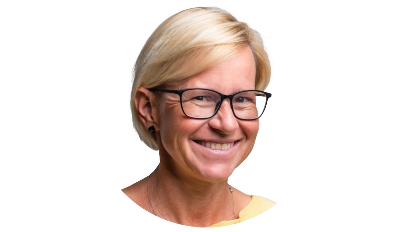 Martina Bartl smiling, with short blonde hair and dark-rimmed glasses, cut out on a white background