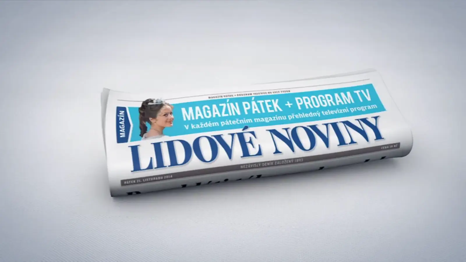 A folded copy of Lidové noviny newspaper with a banner reading "Magazín Pátek + Program TV"