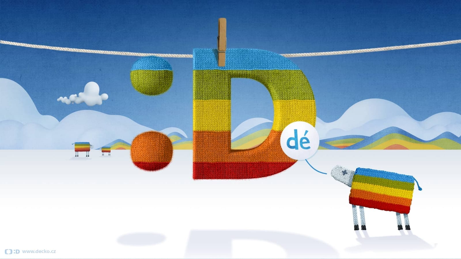 Animated ident for ČT Déčko: knitted rainbow-striped letter D pegged to a washing line, with a striped sheep saying "dé" and the decko.cz logo