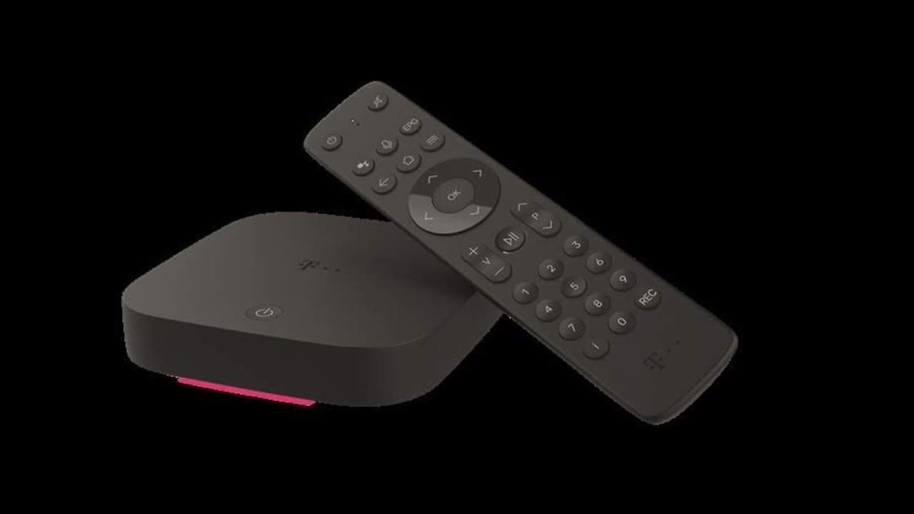 Small black T-Mobile set-top box with magenta light strip and a black remote control on a black background